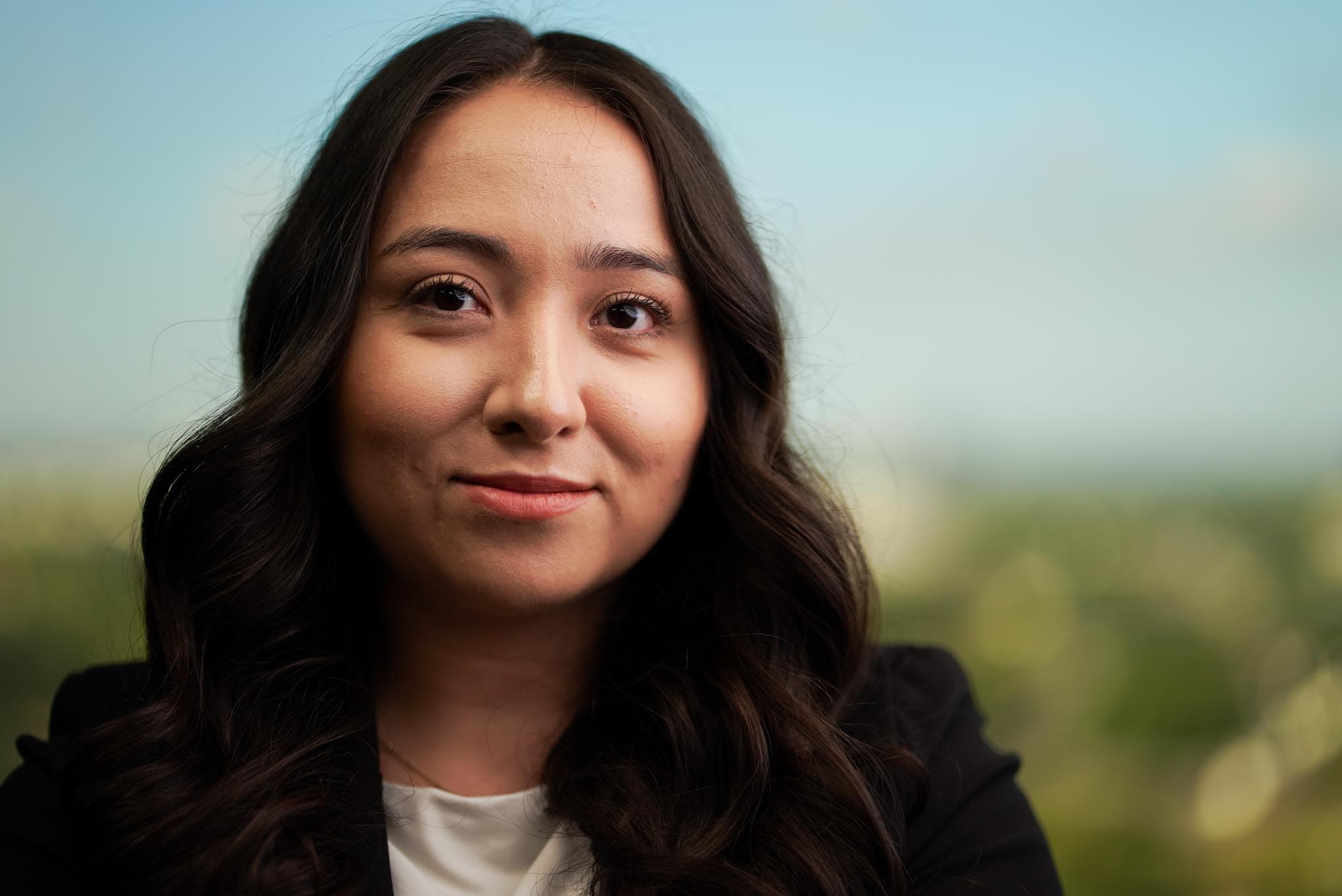 Warm portrait of an Atlas team member smiling.
