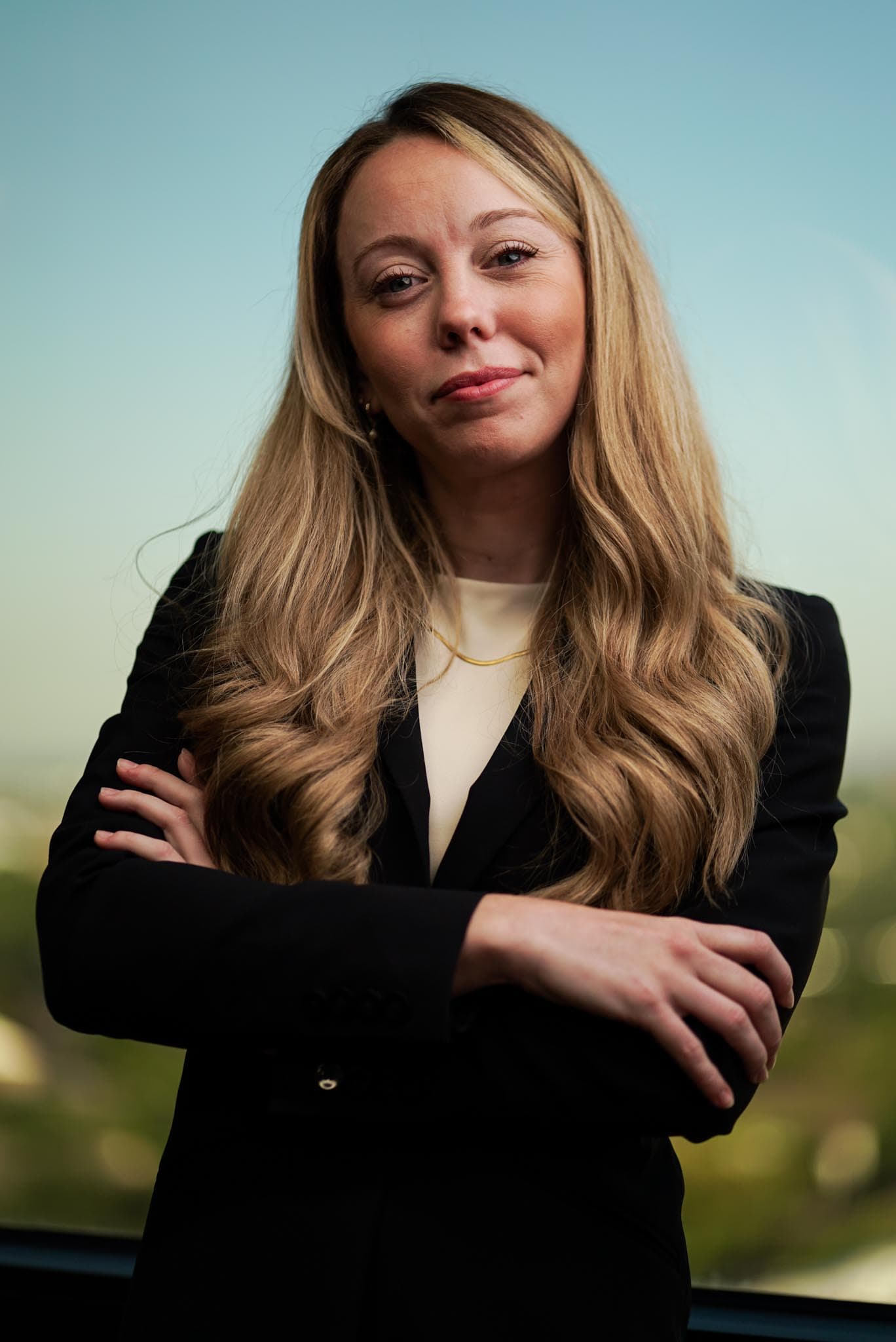 Confident portrait of an Atlas attorney with arms crossed.